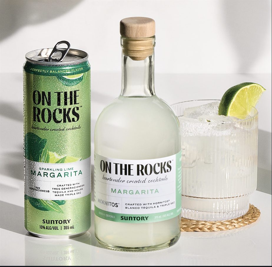 On The Rocks Margarita in a can and bottle beside a poured Margarita with a salted rim.