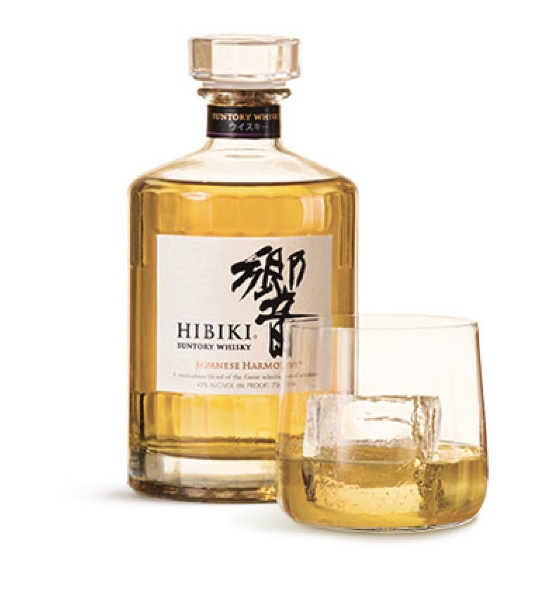 Hibiki Japanese Harmony whisky and a glass over a large ice cube